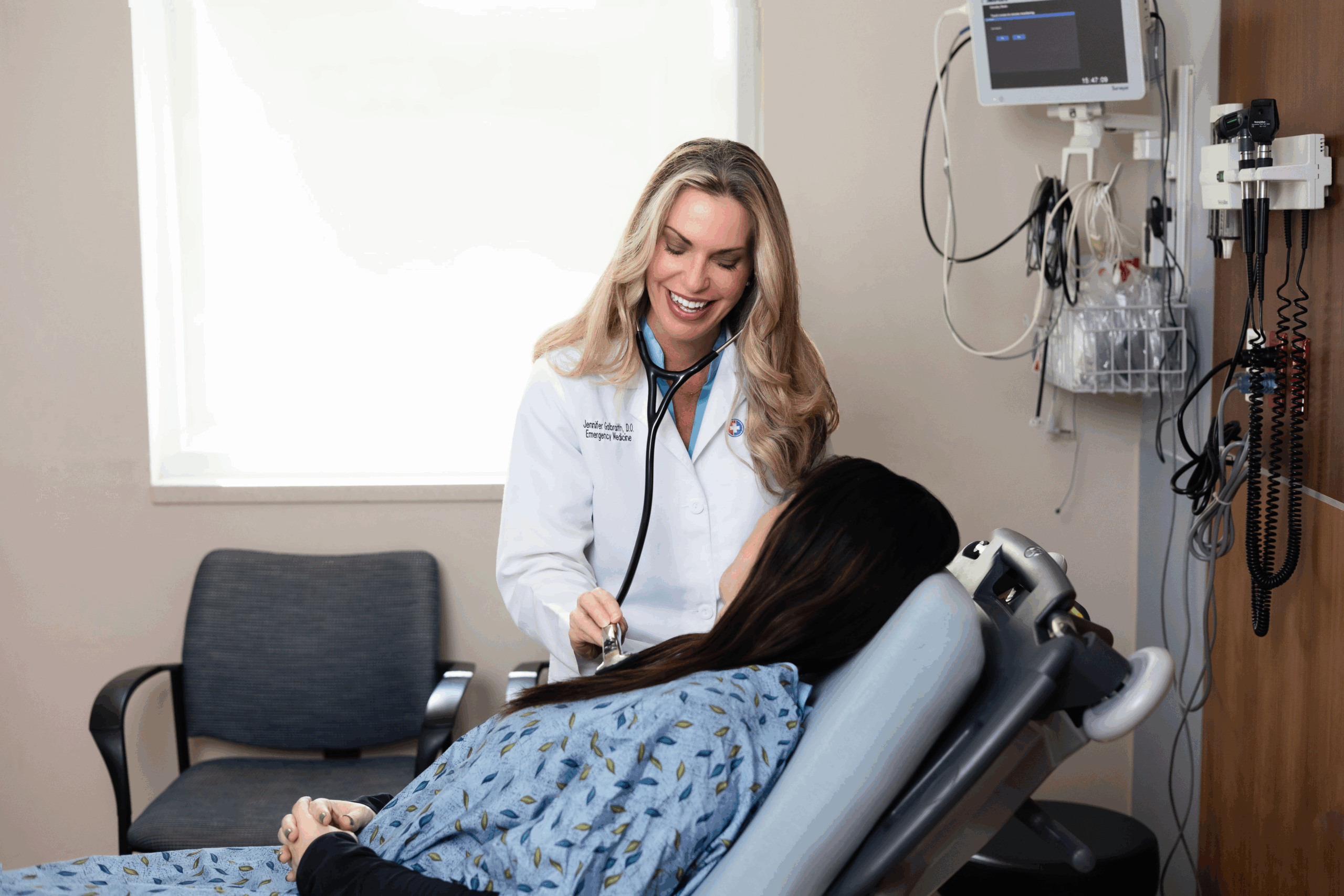 doctor checking patient